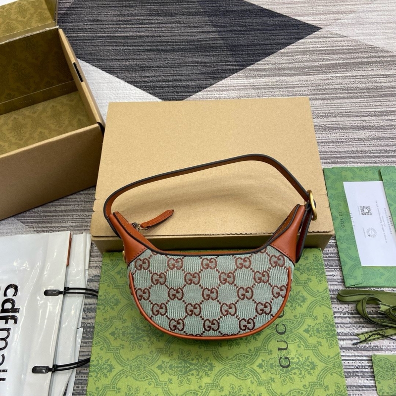 G*u*i top handle bags